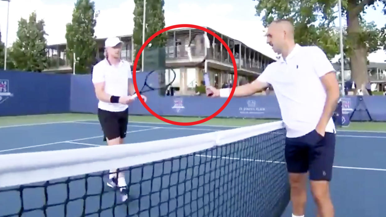 Tennis player Dan Evans (pictured right) reaches out to touch rackets with Kyle Edmund's (pictured left) after their match.