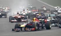 Red Bull Formula One driver Sebastian Vettel of Germany leads the field on turn one of lap one during the Indian F1 Grand Prix at the Buddh International Circuit in Greater Noida, on the outskirts of New Delhi, October 27, 2013. REUTERS/Adnan Abidi (INDIA - Tags: SPORT MOTORSPORT F1)