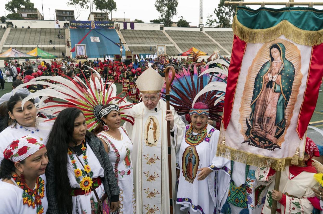 Archbishop of Los Angeles Jose H. Gomez stands with people celebrating the Virgin of Guadalupe's feast day in 2022. <a href="https://newsroom.ap.org/detail/CaliforniaDailyLifeLadyofGuadalupeLosAngeles/cf7e9e11e0fb4ab9aea57b8a3b6ed4bb/photo?Query=guadalupe%20virgin&mediaType=photo&sortBy=arrivaldatetime:desc&dateRange=Anytime&totalCount=1025&currentItemNo=62" rel="nofollow noopener" target="_blank" data-ylk="slk:AP Photo/Damian Dovarganes;elm:context_link;itc:0;sec:content-canvas" class="link ">AP Photo/Damian Dovarganes</a>