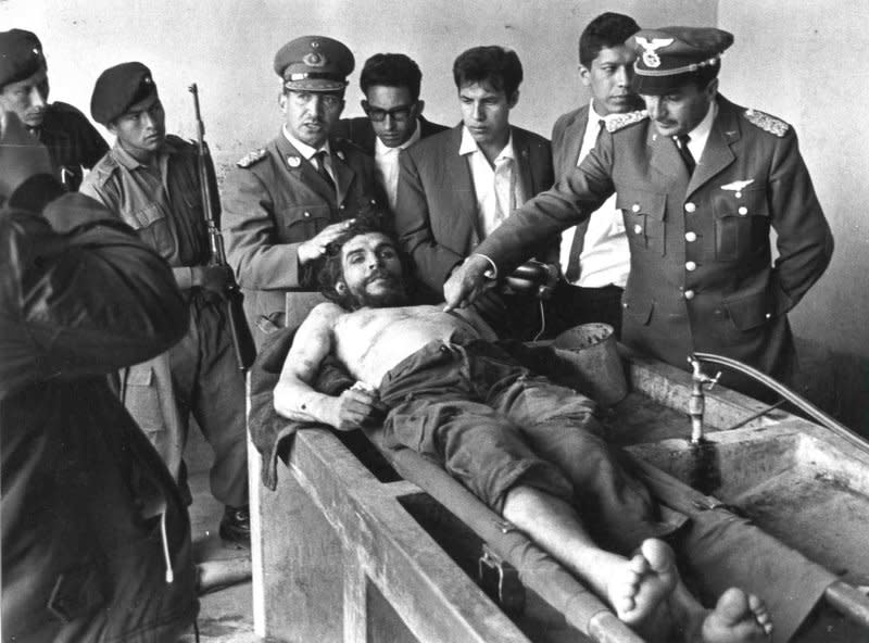 Ernesto "Che" Guevara's body is prepared for public display following his capture and execution by Bolivian troops in 1967. File Photo by Freddy Alborta/UPI