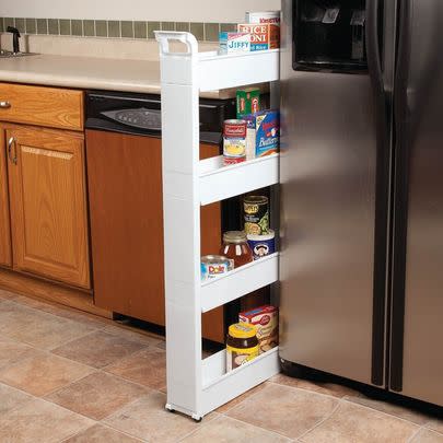 A thin rolling shelf to slip in that weird space between your fridge and cabinets