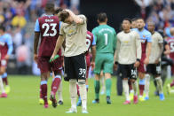 Manchester United's Scott McTominay salutes supporters at at the end of the English Premier League soccer match between West Ham and Manchester United at London stadium in London, Sunday, Sept. 22, 2019. West Ham beat Manchester United 2-0. (AP Photo/Leila Coker)