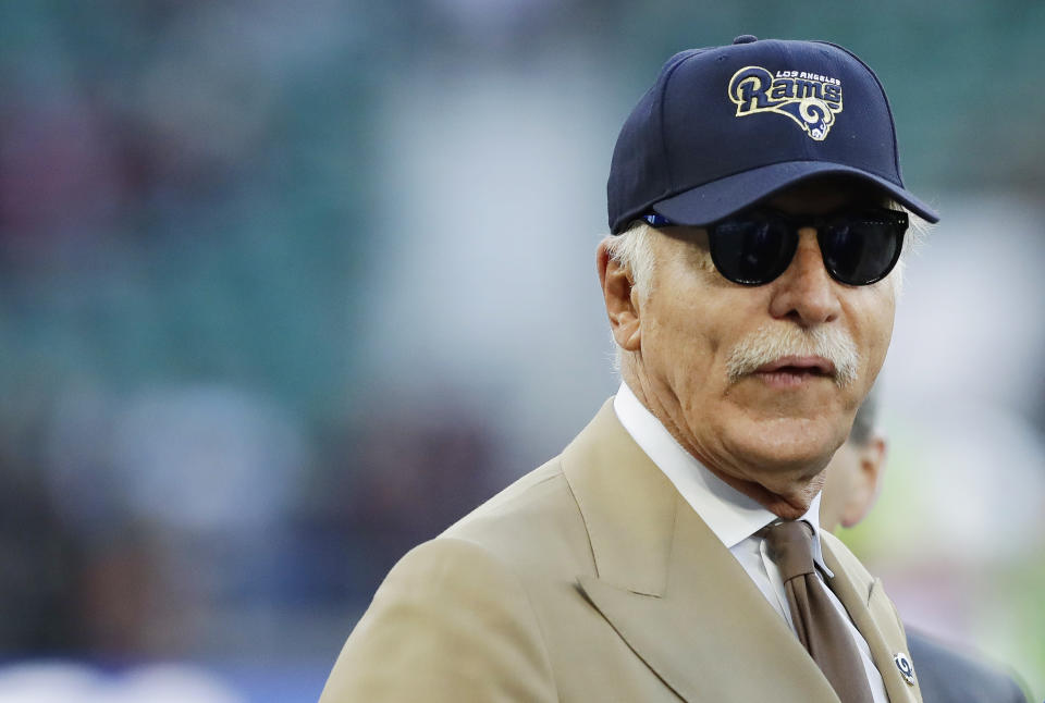 Stan Kroenke the owner of the Los Angeles Rams and the largest shareholder of English Premier League soccer club Arsenal stands on the field before an NFL football game against Arizona Cardinals at Twickenham Stadium in London, Sunday Oct. 22, 2017. (AP Photo/Matt Dunham)