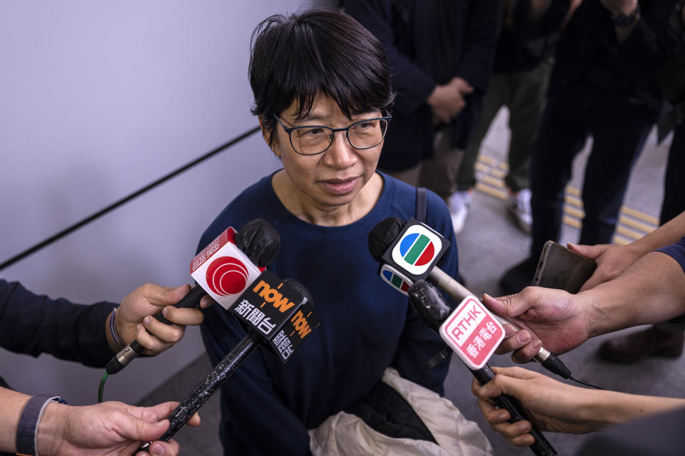Elizabeth Tang, the former chief executive of the now-disbanded pro-democracy group Hong Kong Confederation of Trade Unions, speaks to the press as she walks out the police station in Hong Kong, on Saturday, March 11, 2023. Tang, who was arrested for endangering national security earlier this week, was released on bail on Saturday. (AP Photo/Louise Delmotte)
