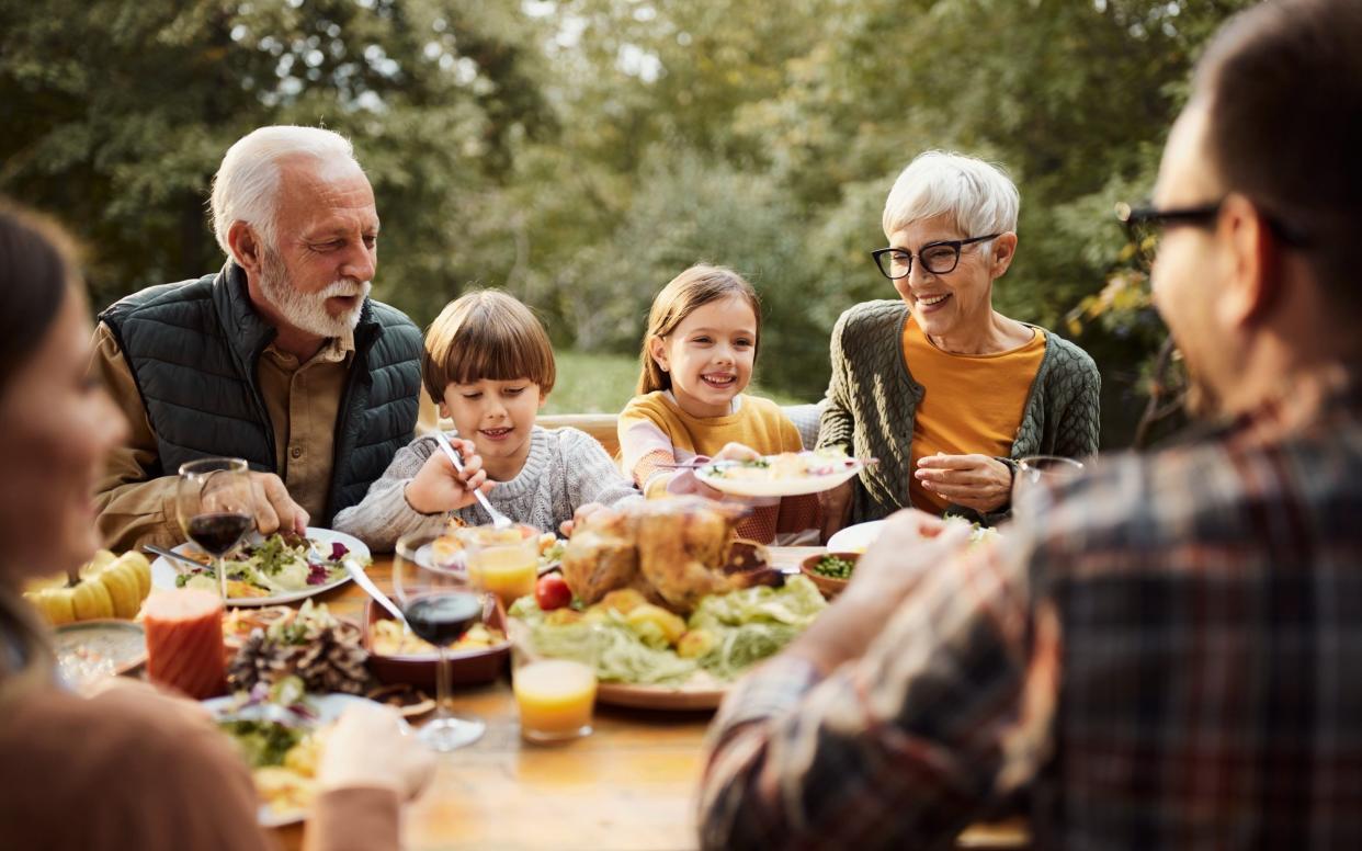 family generations sharing a meal