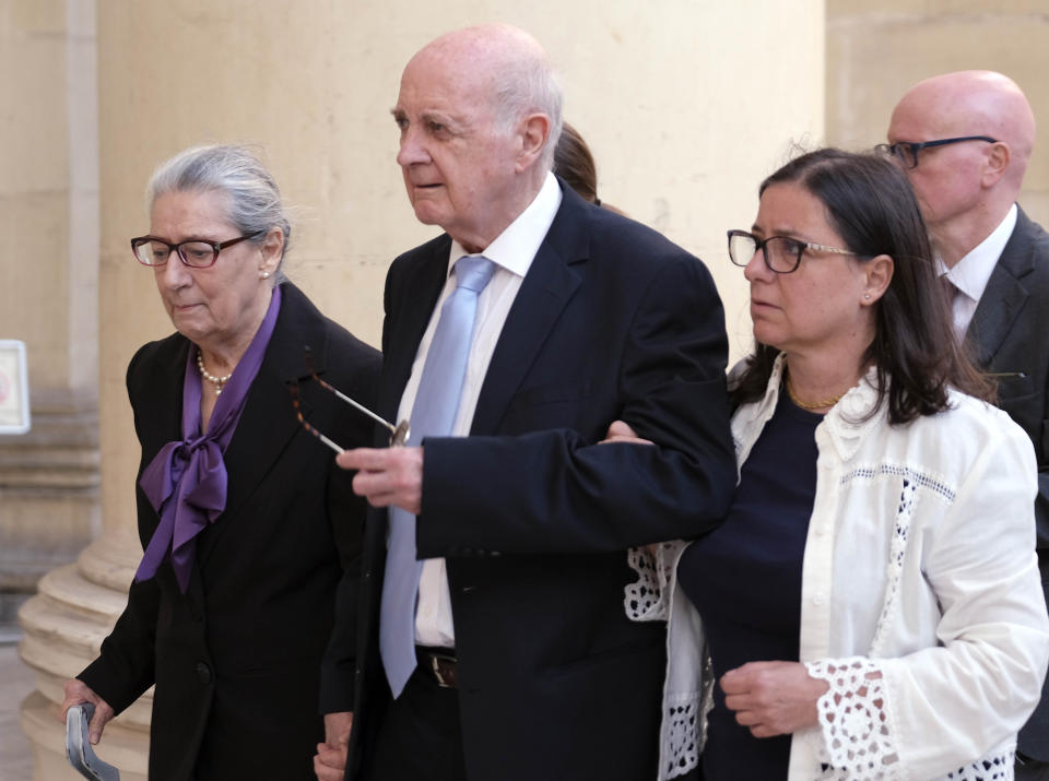 From left, Rose Marie Vella, Michael A. Vella, and Mandy Mallia, parents and sister of late journalist Daphne Caruana Galizia, arrive at Valletta Law court, Friday, Oct. 14, 2022. The first trial for the car-bomb assassination of a Maltese journalist who investigated corruption in the tiny Mediterranean island nation has begun. (AP Photo/Jonathan Borg)