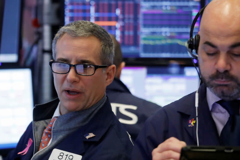 A trader looks at price monitors as he works on the floor at the New York Stock Exchange (NYSE) in New York City, New York, U.S., January 2, 2019. REUTERS/Shannon Stapleton