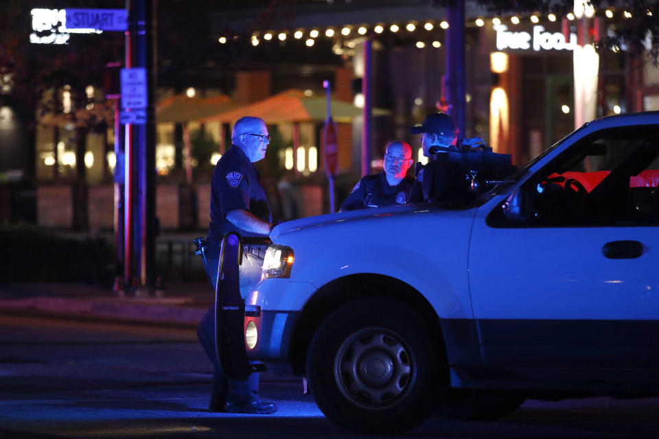 Law enforcement officials respond to reports of a shooting at Ballston Quarter mall in Arlington, Va., Saturday, Sept. 14, 2019. Authorities said they have found no evidence that a shooting occurred at a movie theater that is part of the mall. (AP Photo/Patrick Semansky)