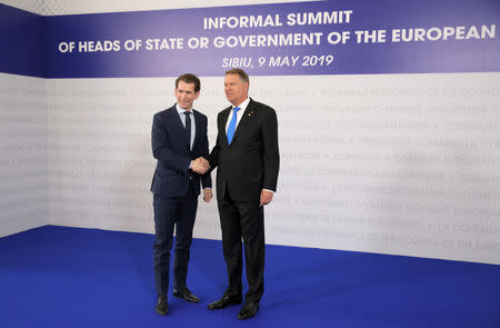 Austrian Chancellor Sebastian Kurz is welcomed by Romanian President Klaus Iohannis as he arrives for the informal meeting of European Union leaders in Sibiu, Romania, May 9, 2019. REUTERS/Stoyan Nenov