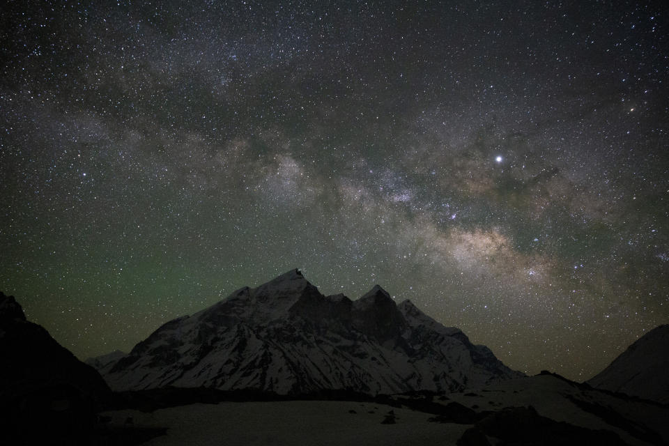 The Milky Way glows above the 6856 meters tall Bhagirathi peaks as seen from Tapovan, at an altitude of 4500 meters in the northern Indian state of Uttarakhand, Friday, May 10, 2019. Bhagirathi peaks feed the Gangotri Glacier, one of the origins of the river Ganges, whose glacial melt water has ensured the arid plains get enough water, even during the driest months. For more than 1,700 miles, from the Gangotri Glacier in the Himalayas to the Bay of Bengal, the Ganges flows across the plains like a timeline of India’s past, nourishing an extraordinary wealth of life. (AP Photo/Altaf Qadri)