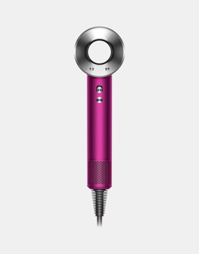 The Dyson Supersonic™ hair dryer is shown in hot pink and silver against a grey background.