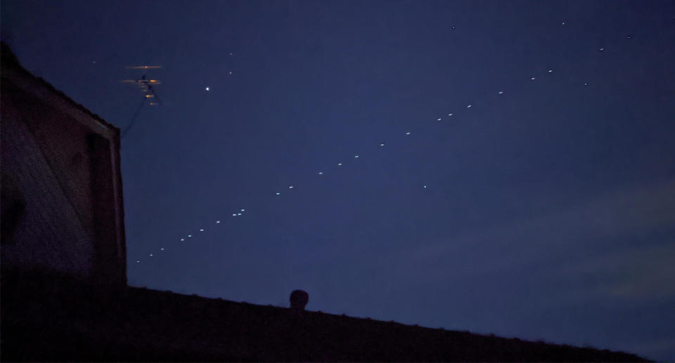 Row of lights seen in the night sky above Melbourne.