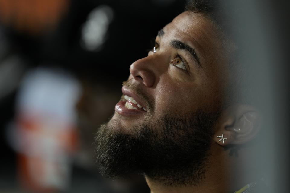 Chicago White Sox's Yoan Moncada waits in the dugout before a baseball game against the Houston Astros, Friday, May 12, 2023, in Chicago. (AP Photo/Erin Hooley)