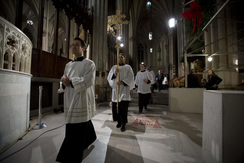 Choir boys walk in during Midnight Mass at St. Patrick's Cathedral on Christmas Day in New York