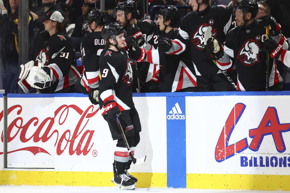 Buffalo Sabres left wing Zach Benson (9) is congratulated for his goal against the Los Angeles Kings during the second period of an NHL hockey game Tuesday, Feb. 13, 2024, in Buffalo, N.Y. (AP Photo/Jeffrey T. Barnes)