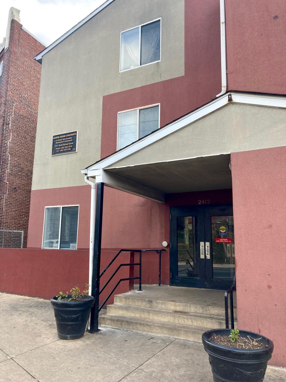 The front entrance of Herring Manor, a subsidized apartment building for seniors and those with disabilities in Wilmington.