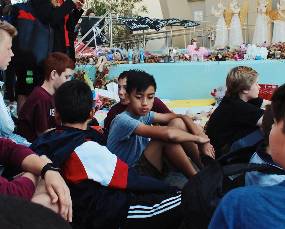 One month after the massacre, Westglades Middle School students take part in the National School Walkout by leaving class and meeting up with peers at Pine Trails Park, where memorials for each of the 17 victims were erected.