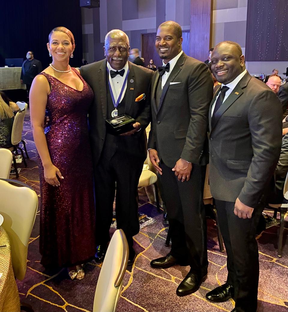 Shaia Simmons, FAMU football head coach Willie Simmons and FAMU VP/AD Kortne Gosha pose with Rudy Hubbard (second from left) after he was inducted into the College Football Hall of Fame.