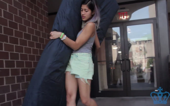 Emma Sulkowicz carrying her mattress around campus at Columbia University. Photo: YouTube.