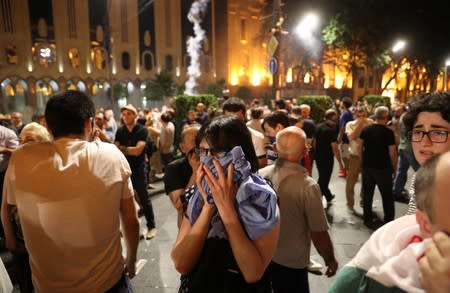 People attend a protest against a Russian lawmaker's visit in Tbilisi