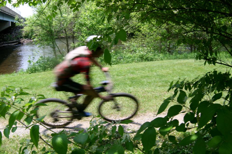 A racer bikes through Mohican State Park on Saturday during the Mohican Mountain Bike races.