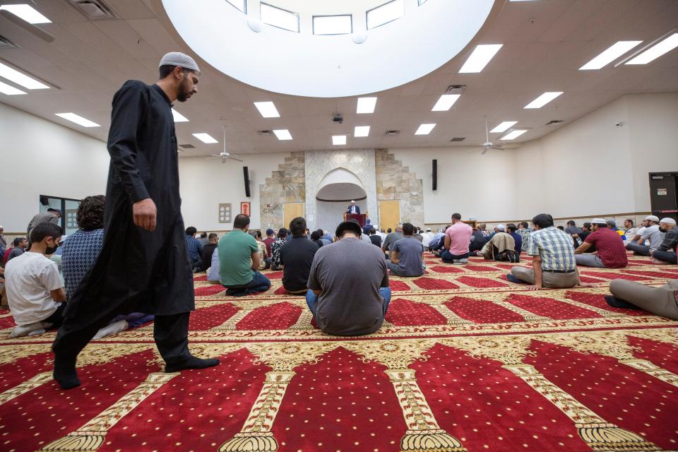 Muslims arrive for Friday prayer services at the Islamic Center of New Mexico during Friday prayer services on August 12, 2022. 