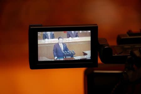 A camera screen shows China's President Xi Jinping speaking during the ceremony to mark the 90th anniversary of the founding of the China's People's Liberation Army at the Great Hall of the People in Beijing, China August 1, 2017. REUTERS/Damir Sagolj