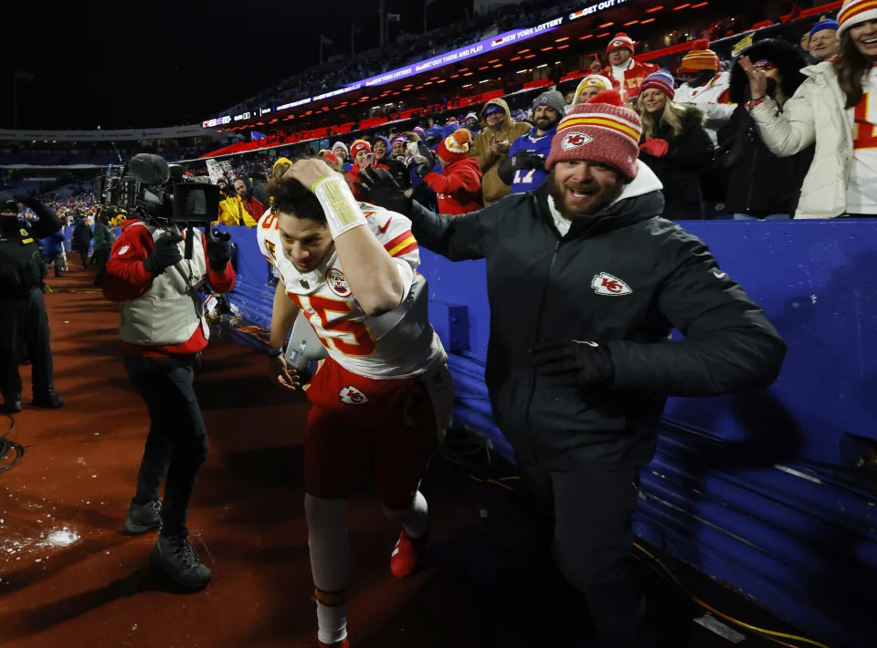 Patrick Mahomes dodges snowballs from the stands in Buffalo. (Al Bello/Getty Images)