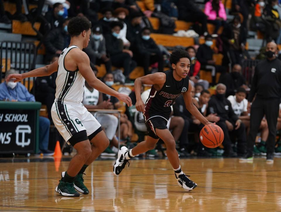 Lance Stone (0) of Detroit Renaissance drives the ball while being guarded by Terrance Broughton of Detroit Cass Tech during the PSL boys quarterfinals at Detroit Cass Tech in Detroit on Tuesday, February 15, 2022.