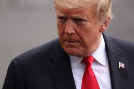 FILE PHOTO: U.S. President Donald Trump talks to reporters as he heads to the Marine One helicopter to depart the White House for travel to Florida in Washington, U.S. October 8, 2018.  REUTERS/Jonathan Ernst/File Photo