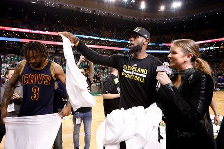 May 25, 2017; Boston, MA, USA; Cleveland Cavaliers forward LeBron James (23) hands out conference champion shirts to his teammates after game five of the Eastern conference finals of the NBA Playoffs against the Boston Celtics at the TD Garden. Mandatory Credit: Greg M. Cooper-USA TODAY Sports