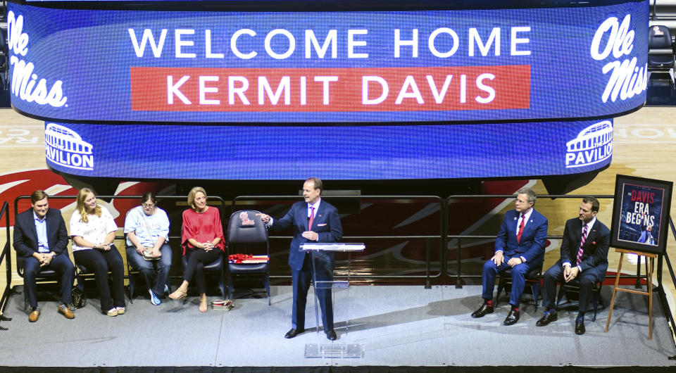 Kermit Davis Jr., center, is introduced as Mississippi’s new men’s basketball coach in Oxford, Miss., Monday, March 19, 2018. (Bruce Newman, Oxford Eagle via AP)