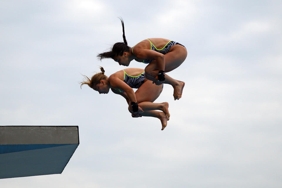 SHANGHAI, CHINA - JULY 18: Meaghan Benfeito and Roseline Filion of Canada compete in the Women's 10m Platform Synchro Final during Day Three of the 14th FINA World Championships at the Oriental Sports Center on July 18, 2011 in Shanghai, China. (Photo by Quinn Rooney/Getty Images)