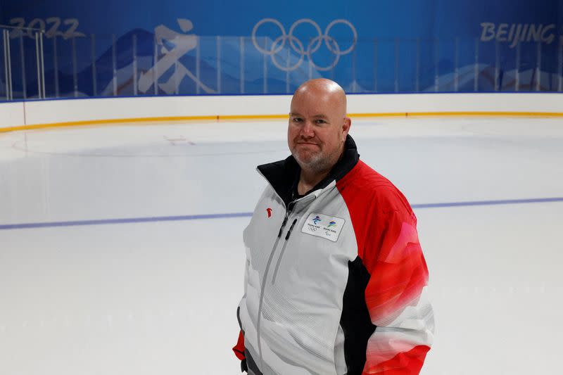 Rick Ragan, chief icemaker for the main hockey venue at the 2022 Winter Olympics, the Wukesong Arena, poses for photos, in Beijing