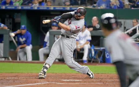 Sep 29, 2018; Kansas City, MO, USA; Cleveland Indians first baseman Yonder Alonso (17) connects for a one run single in the third inning against the Kansas City Royals at Kauffman Stadium. Mandatory Credit: Denny Medley-USA TODAY Sports