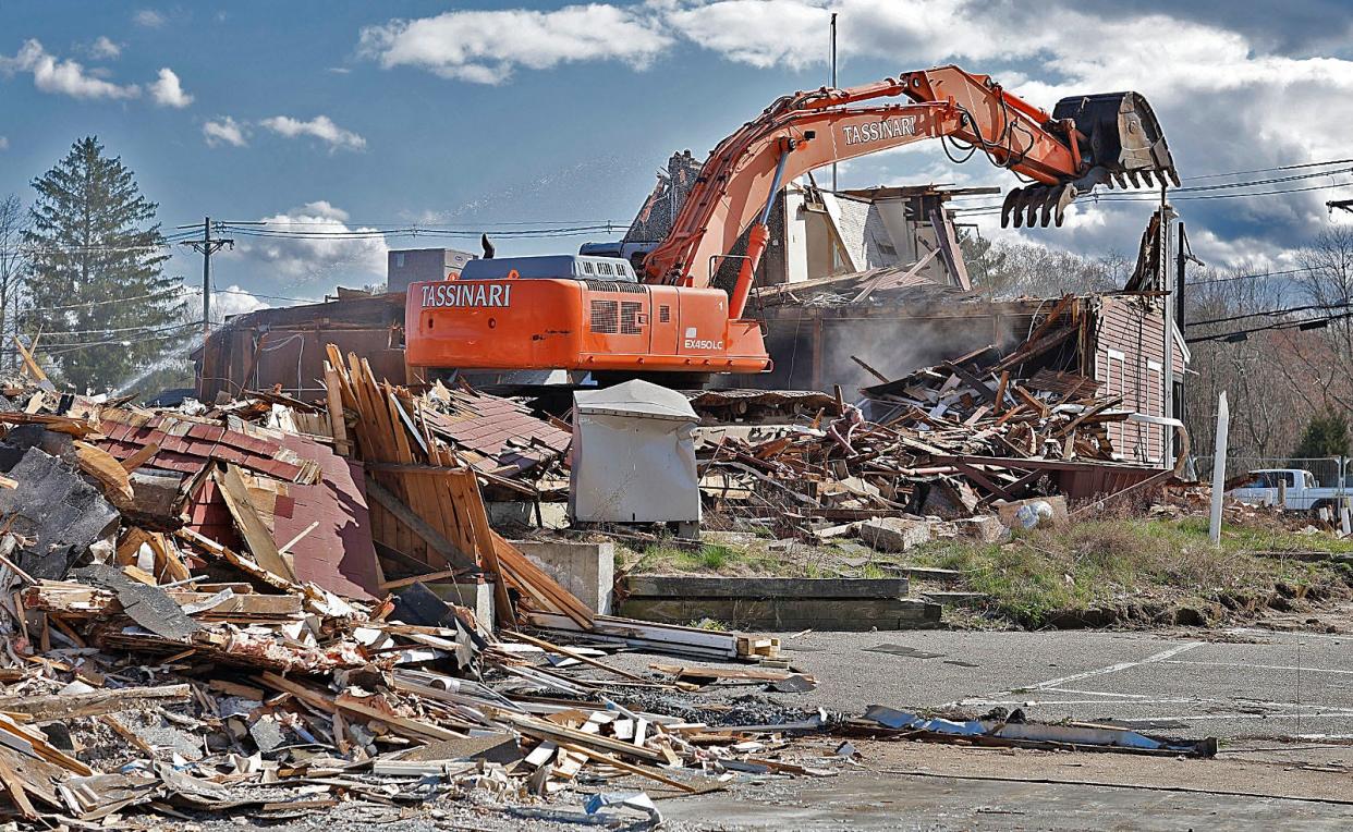 The old Assinippi General Store is demolished to make way for expansion of Merchants Row on Washington Street in Hanover on Wednesday April 24, 2024