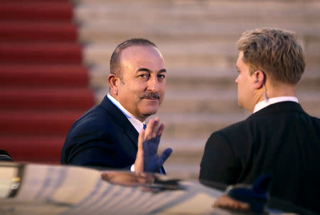 Turkish Foreign Minister Mevlut Cavusoglu arrives to attend the state banquet for Turkish President Tayyip Erdogan, at the Bellevue presidential palace in Berlin, Germany, September 28, 2018. REUTERS/Reinhard Krause