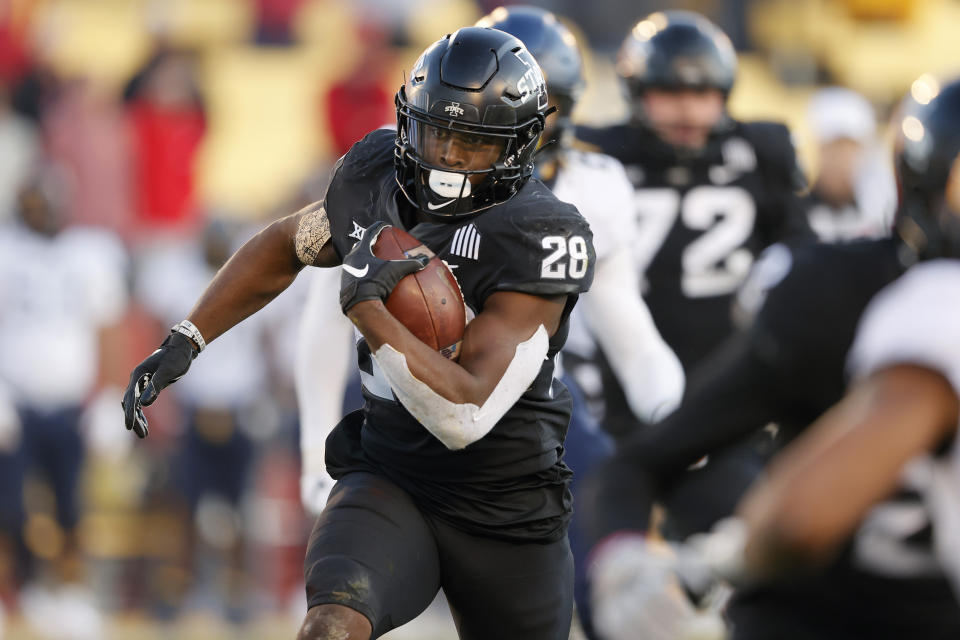 Iowa State running back Breece Hall runs the ball against West Virginia during the first half of an NCAA college football game, Saturday, Dec. 5, 2020, in Ames, Iowa. (AP Photo/Matthew Putney)