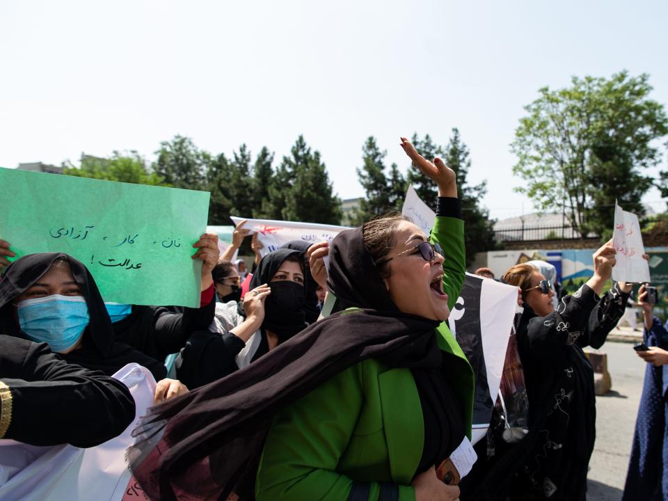 Taliban fighters fired into the air as they dispersed a rare rally by women as they chanted "Bread, work and freedom" and marched in front of the education ministry building, days ahead of the first anniversary of the hardline Islamists' return to power, on August 13, 2022 in Kabul, Afghanistan.