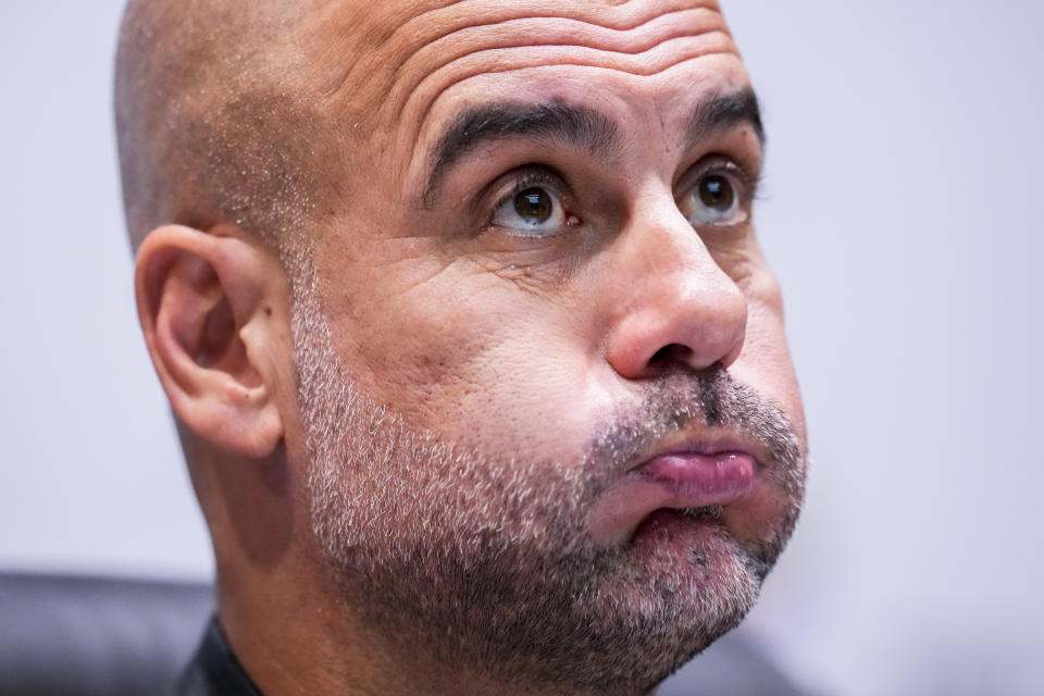 Manchester City's head coach Pep Guardiola attends a press conference at the King Abdullah Sports City Stadium in Jeddah, Saudi Arabia, Thursday, Dec. 21, 2023. Manchester City will play against Fluminense during the final soccer match of the Club World Cup on Friday Dec. 21. (AP Photo/Manu Fernandez)