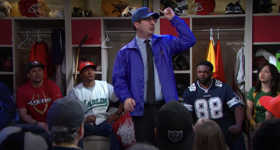 John Oliver speaking to a locker room like he is a coach