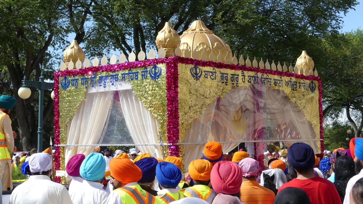 The first float in every Nagar Kirtan procession contains the Sri Guru Granth Sahib Ji, the holy text of the Sikh religion.  (Travis Golby/CBC - image credit)