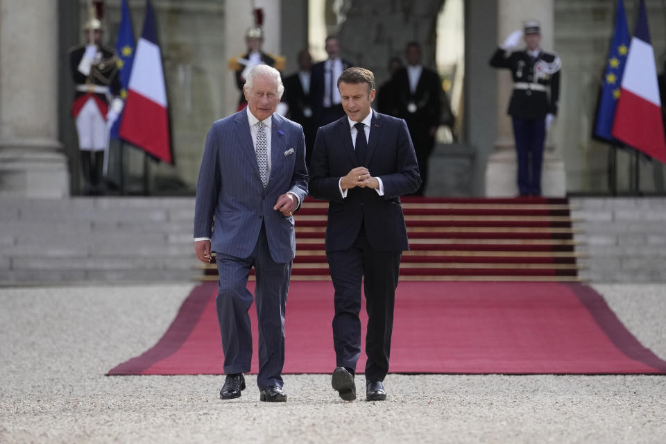 French President Emmanuel Macron, right, and Britain's King Charles III leave the Elysee Palace for a walk to the British ambassador to France's residence, Wednesday, Sept. 20, 2023 in Paris. King Charles III of the United Kingdom starts a three-day state visit to France on Wednesday meant to highlight the friendship between the two nations with great pomp, after the trip was postponed in March amid widespread demonstrations against President Emmanuel Macron's pension changes. (AP Photo/Thibault Camus, Pool)