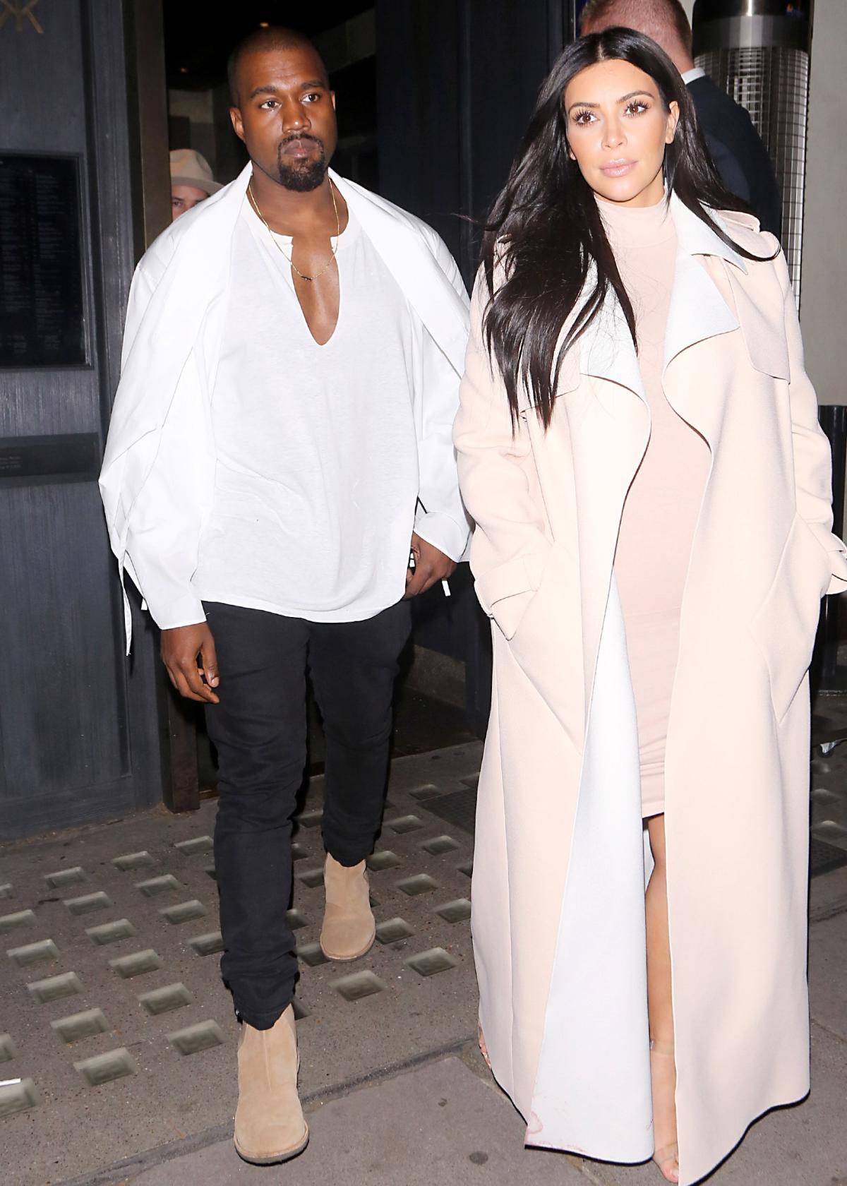 Kanye West and Kim Kardashian arrive to Louis Vuitton Fall/Winter