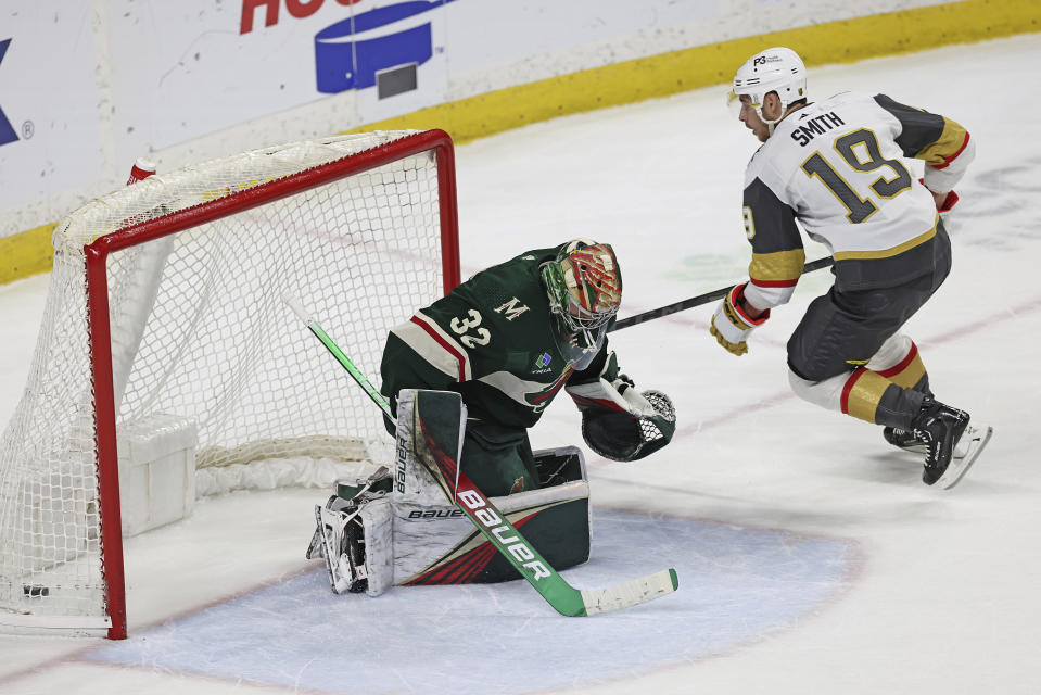 Vegas Golden Knights right wing Reilly Smith (19) scores the winning goal in a shootout against Minnesota Wild goaltender Filip Gustavsson (32) during an NHL hockey game Monday, April 3, 2023, in St. Paul, Minn. (AP Photo/Stacy Bengs)