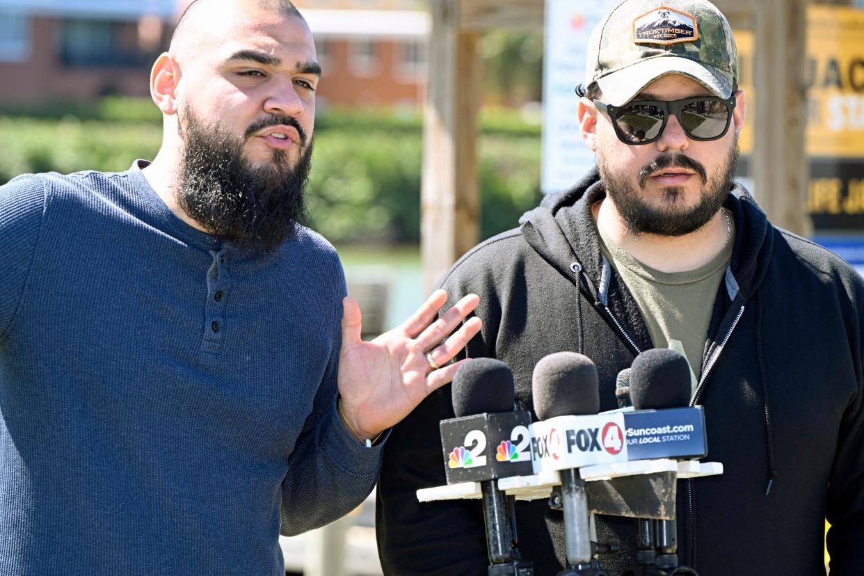 Ruben Mora Jr., left, and Juan Raul Mora, talked briefly with the media Monday afternoon, asking for boaters to keep a look out for their missing father, Ruben Mora Sr., and three friends, who never returned from a Saturday fishing trip in the Gulf of Mexico.