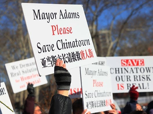 A sign that says "Mayor Adams Please save Chinatown"