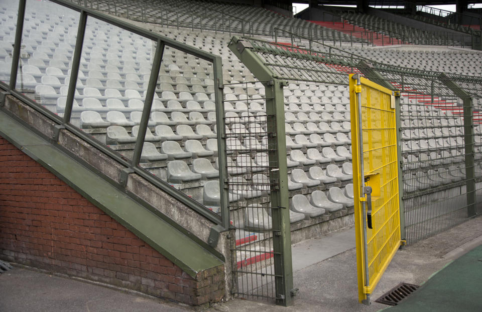 FILE - In this Friday, May 29, 2015 file photo, a metal cage surrounds a supporter section at the King Boudouin (formerly the Heysel) Stadium in Brussels. Friday. May 29, 2020 marks 35 years since 39 victims lost their lives during a European Cup football match between Liverpool and Juventus due to a surge of rival supporters resulting in a collapsed wall. (AP Photo/Virginia Mayo, File)