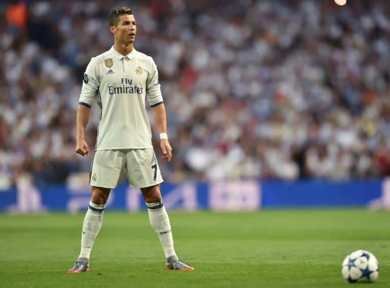 Real Madrid's Portuguese forward Cristiano Ronaldo prepares for a free kick during the UEFA Champions League quarterfinal match against Bayern Munich at the Santiago Bernabeu stadium in Madrid, Spain, on April 18, 2017