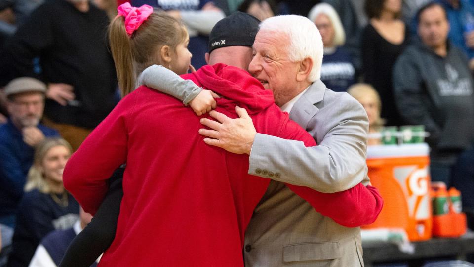 St. Augustine's head boys basketball coach Paul Rodio, right, hugs former St. Augustine player Clint Beyers prior to the game between St. Augustine and Ocean City, played at St. Augustine Preparatory School in Richland on Wednesday, January 11, 2023.  Rodio won his 1,000th career victory as St. Augustine defeated Ocean City.